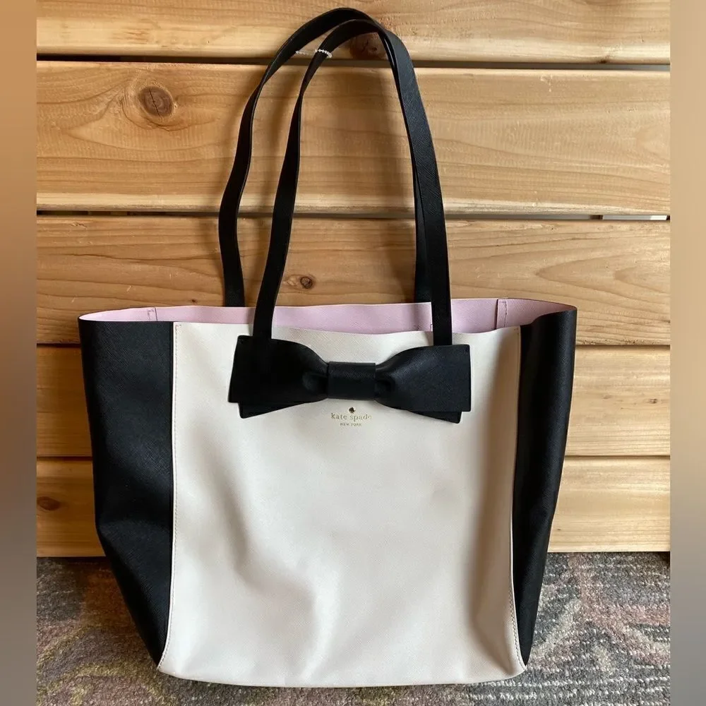 Kate  Spade  Purse with Bow color bag is Black and White